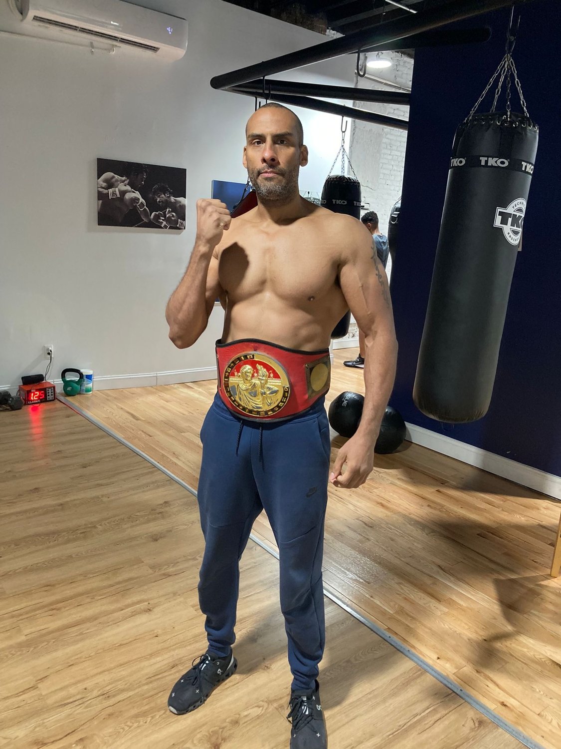 Central Park Boxing coach wearing his championship belt